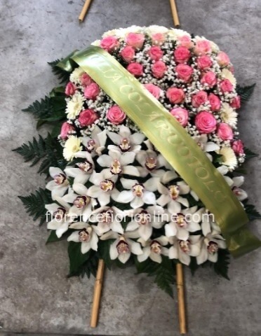 Cuscino funebre con piedini, orchidee, gerbere e rose