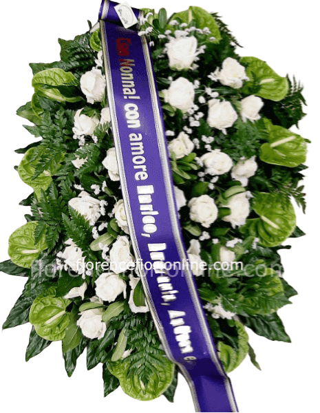 Cuscino funebre con anthurium verdi e rose bianche.